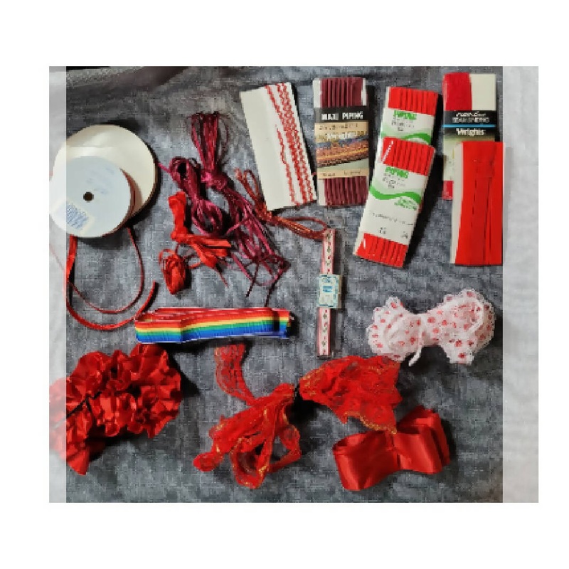Bundle of red sewing trims and laces