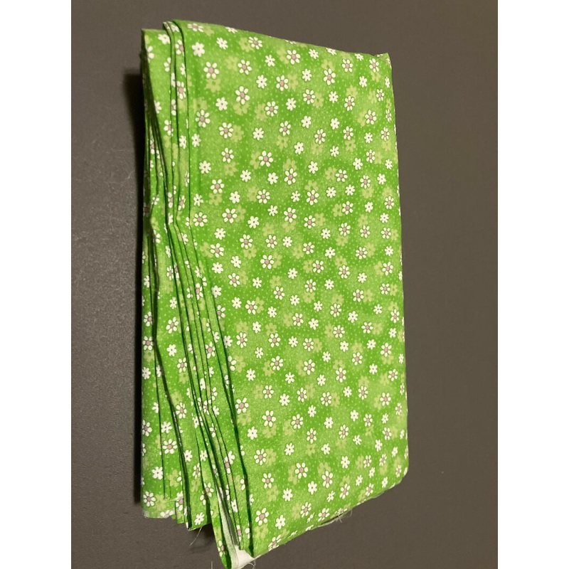 Daisies on Green Fabric