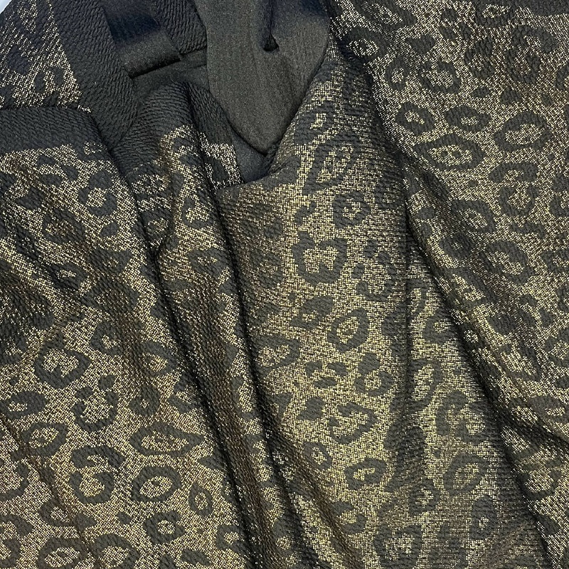 Leopard Spotted Black and Gold Liverpool Synthetic Knit - 2.75 Yds
